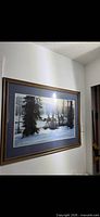 Full view of framed winter horses print on wall