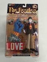 Front view of sealed Paul Yellow Submarine action figure with accessories
