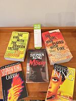 All five books and bookmark pad on tabletop