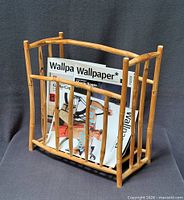 Front view of bamboo magazine rack with magazines for scale