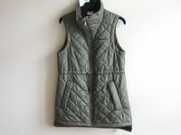 Front view of quilted sleeveless Columbia jacket hanging
