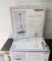 Two sealed allen + roth Sevierville chandelier boxes showing model and branding