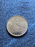 Reverse of 2005 Saskatchewan commemorative quarter showing bird design