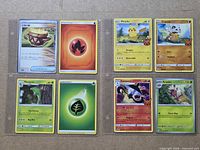 Binder page showing eight Pokémon and Energy cards