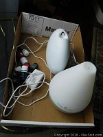 Photo showing the diffusers, essential oil bottles, and cords inside a cardboard box.