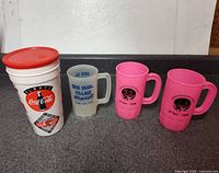 Front view of all four souvenir cups lined up