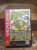 Front of clamshell case with cover art and Genesis branding