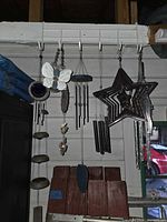 Group of wind chimes hanging on rack