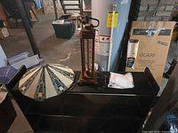 Whole lot: shade and metal fixture on shelf