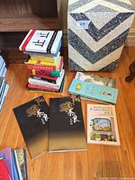 Stack of Japanese language books, two 奈良 pictorial books, two children’s books visible