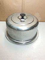 Stainless steel dome on glass plate side view