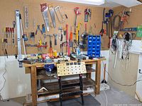 Overall view of tools on pegboard and workbench