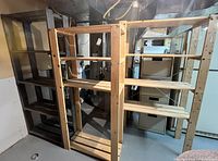 Front view of three wooden shelving units side-by-side
