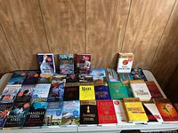 Full table view showing assorted Danielle Steel paperbacks and hardcovers (~40 books)