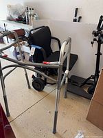 Scooter side view with removable seat and walker visible