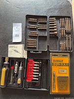 Overall view of all bit sets, handle, accessories, instruction sheet and DeWalt package