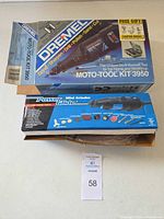 Two retail boxes: Dremel Moto-Tool Kit 3950 and Power Glide mini grinder