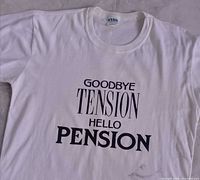 Full front view of t-shirt showing graphic and neckline tag