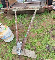 Top view of lawn roller showing frame, tow hitch and propane tank for scale
