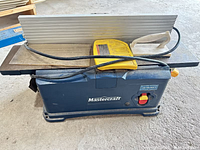 Front view of Mastercraft jointer with fence and push block