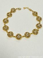 Full view of bracelet laid flat showing design and clasp