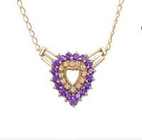 Front view of necklace showing pendant design and gemstone arrangement