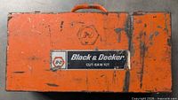 Orange metal case exterior with Black & Decker logo