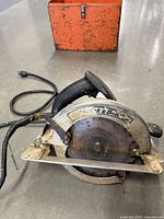 Front view of Black & Decker circular saw with blade and power cord