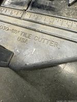 Markings showing 030-4-1/2 Tile Cutter USA cast into base