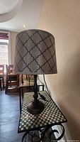 Lamp standing on side table showing full view