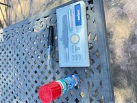 Full set on table: soldering iron handle, accessory case open, Mag-Torch fuel can
