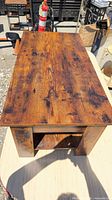 Top view of pine coffee table showing distressed surface and grain