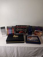 All seven box sets grouped on table