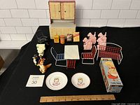 Overview of lot showing metal cabinet, wire furniture, ramp walkers, Minnie Mouse figures, china plates, grocery boxes