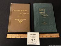 Two hardcover gardening books side by side with ruler for scale
