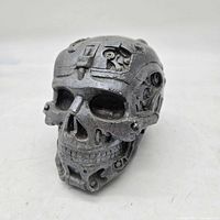 Front three-quarter view of silver resin steampunk skull