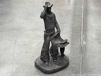 Front view of Michael Garman cowboy sculpture