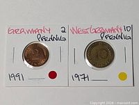 Both coins in holders showing denominations and years