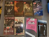 Seven VHS tapes laid out, titles readable