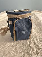 Front view of blue/tan insulated cooler bag with branding