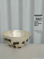 Side view of capiz shell bowl showing leaf motif decoration