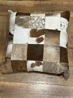 Front view showing patchwork cowhide pattern