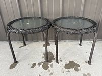 Both round outdoor side tables side-by-side