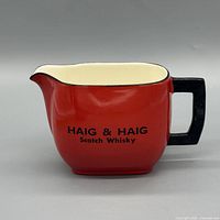 Front view showing Haig & Haig Scotch Whisky text and handle
