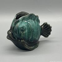 Left-side view of ceramic fish planter showing glaze and form