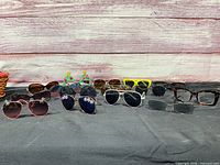 Front view of all eyewear pairs on cloth backdrop