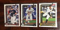 Fronts of three rookie baseball cards side by side