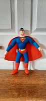 Front view of Superman plush standing