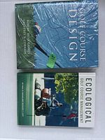 Front covers of both hardcover books, one sealed