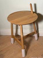 Full view of Altay side table showing top, legs, vertical dowel accent and felt leg protectors